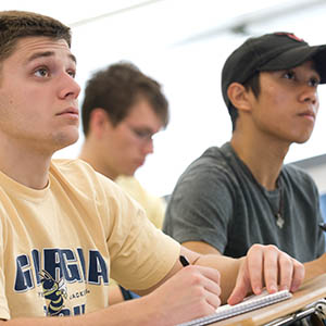 Two students listening to a lecture